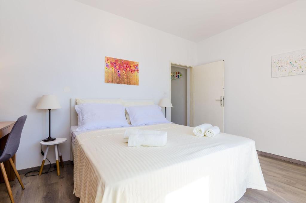 Posteľ alebo postele v izbe v ubytovaní Apartments Knego