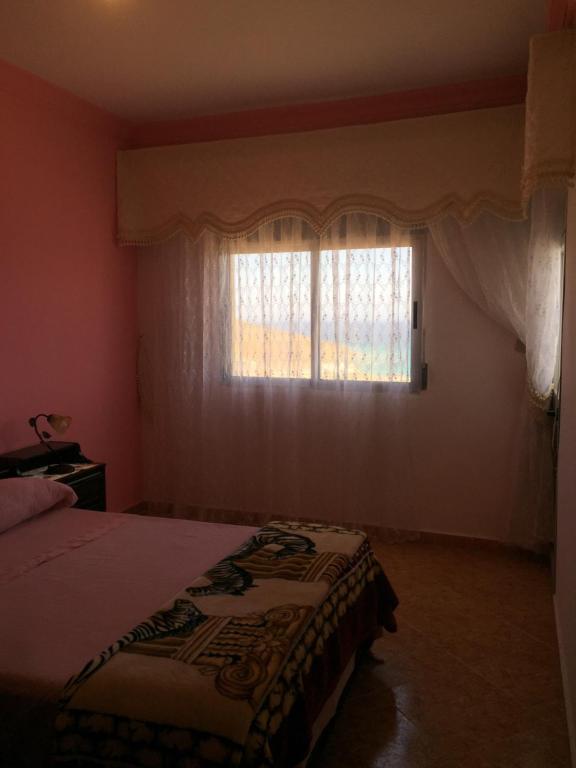 Postel nebo postele na pokoji v ubytování Casa Dina