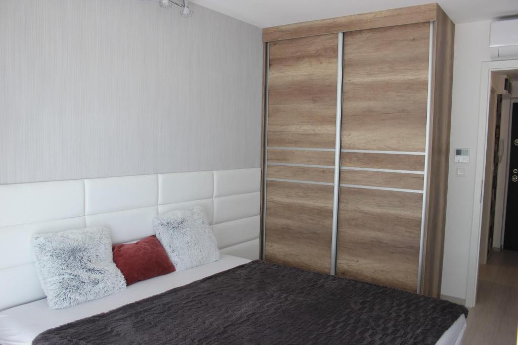 Posteľ alebo postele v izbe v ubytovaní Katus Apartman Siófok