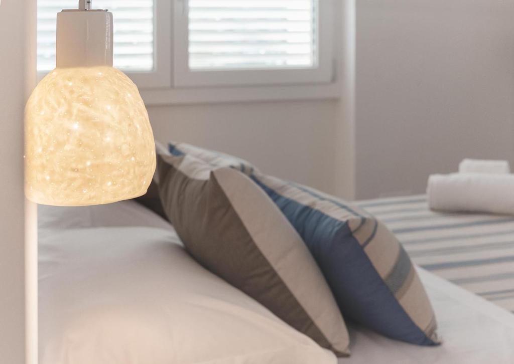 Łóżko lub łóżka w pokoju w obiekcie B&B Il Cortiletto