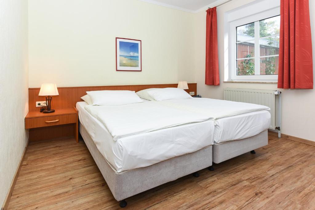 Postel nebo postele na pokoji v ubytování Hotel Garni Benser Watt