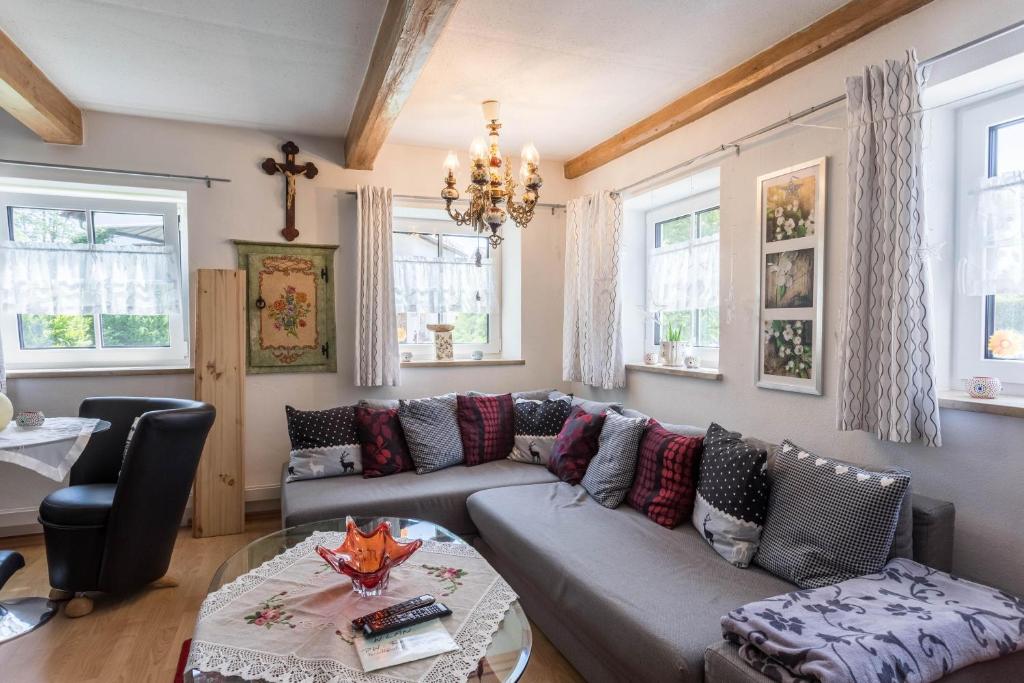 a living room with a couch and a table at Ferienhaus Carin in Utting