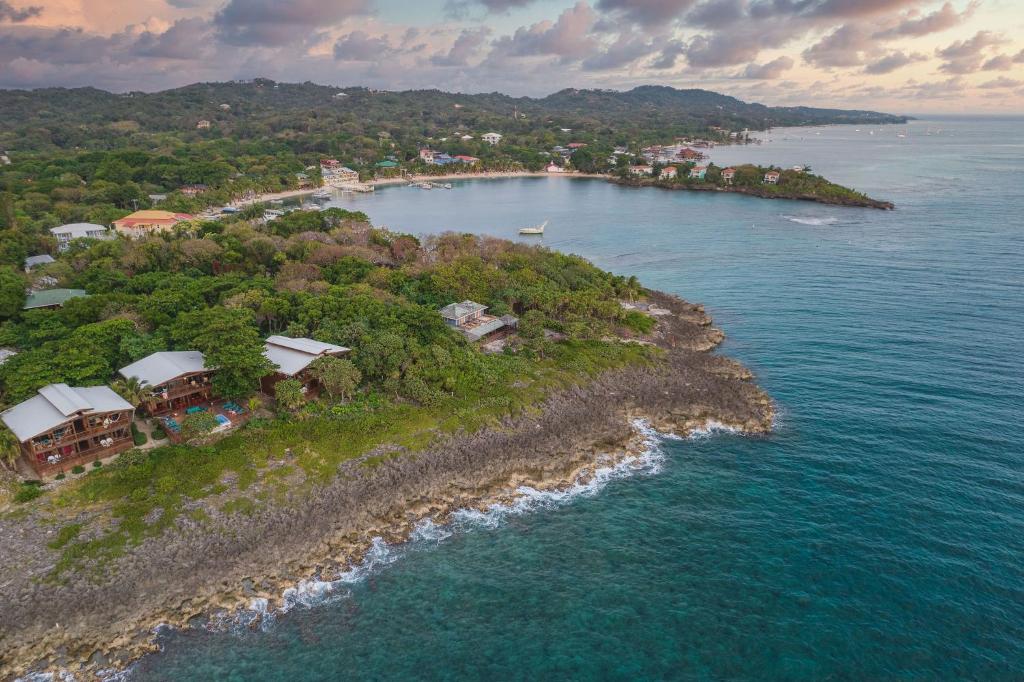 an aerial view of an island in the ocean at Cocolobo Resort in West End