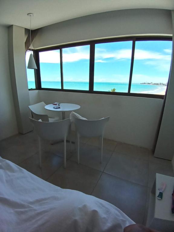  Flat Suíte Premium 35m2 Vista Mar com Água Mineral e Cozinha em Hotel Home Service