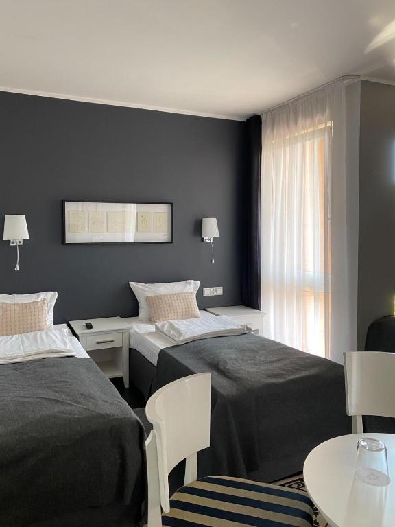 Postel nebo postele na pokoji v ubytování HOTEL Amber Suite & SPA - Enklawa dla Dorosłych