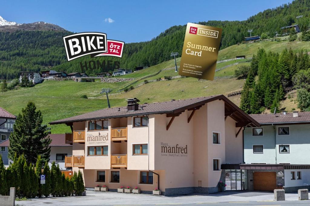 a building with two signs on top of it at Haus Manfred in Sölden