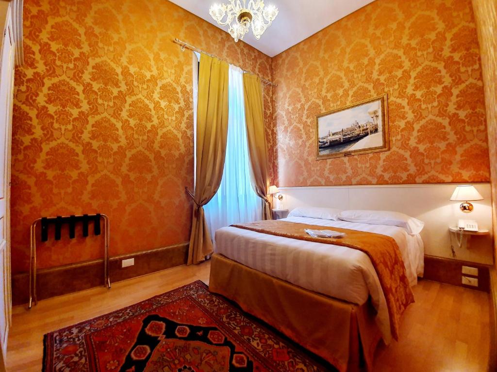 Postel nebo postele na pokoji v ubytování Hotel Corte dei Greci