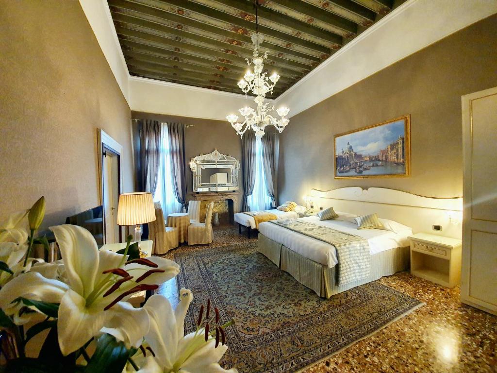 Postel nebo postele na pokoji v ubytování Hotel Corte dei Greci