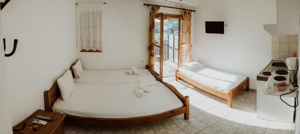 Postel nebo postele na pokoji v ubytování Filippos Rooms Afissos