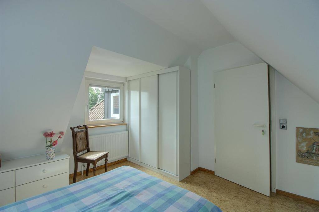 Postel nebo postele na pokoji v ubytování Haus Tapken mit Meerblick
