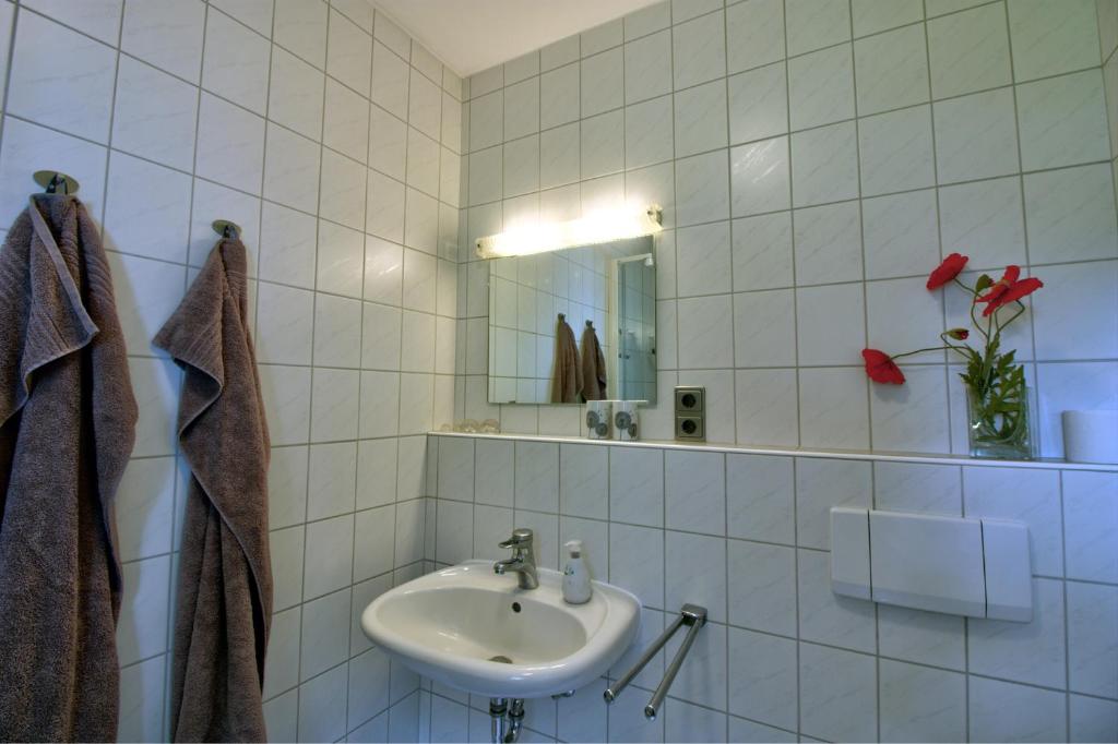 Koupelna v ubytování Haus Tapken mit Meerblick