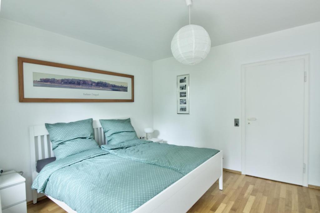 Postel nebo postele na pokoji v ubytování Haus Tapken mit Meerblick
