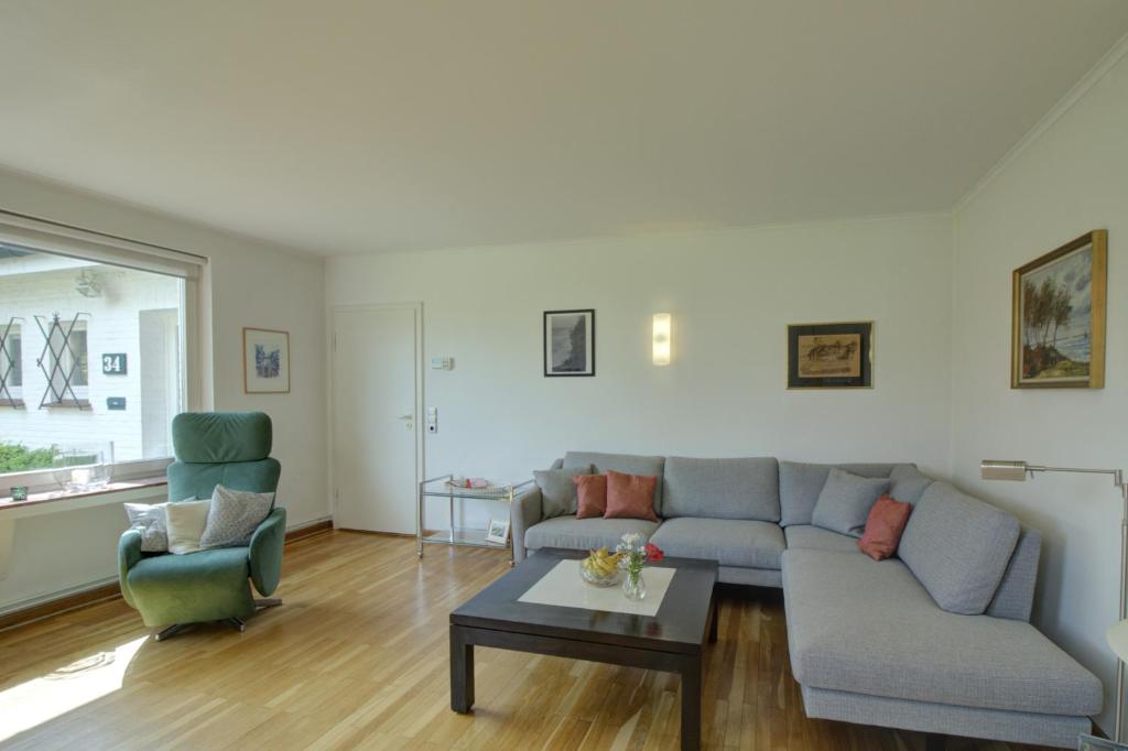 Posezení v ubytování Haus Tapken mit Meerblick