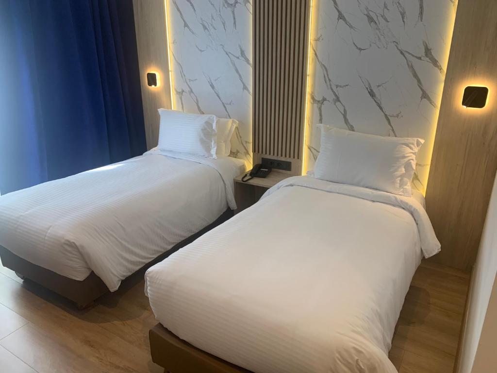 Postel nebo postele na pokoji v ubytování Rihab Hotel