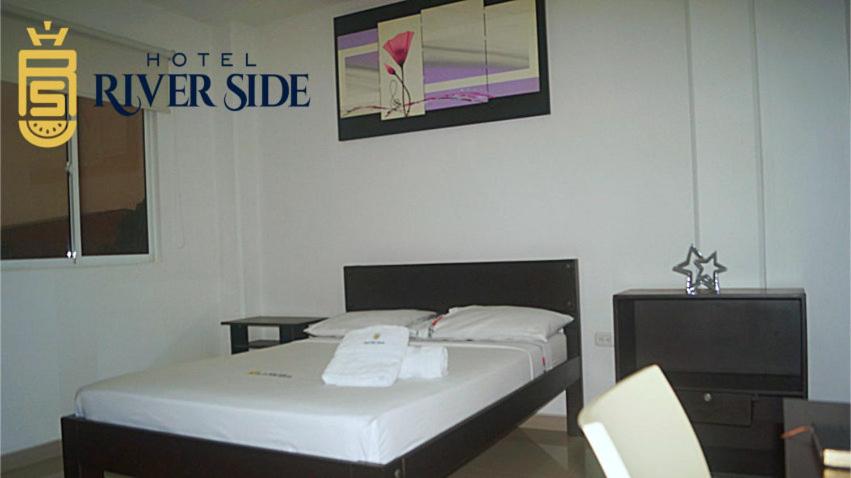 Postel nebo postele na pokoji v ubytování Hotel River Side