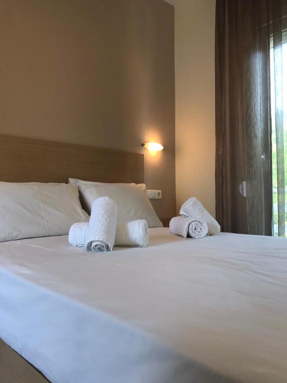 Postelja oz. postelje v sobi nastanitve Tasos Rooms