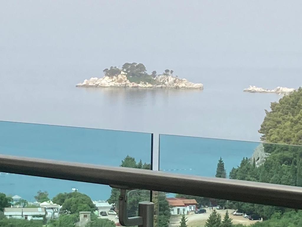 an island in the water seen from a balcony at The View apartment in Petrovac na Moru