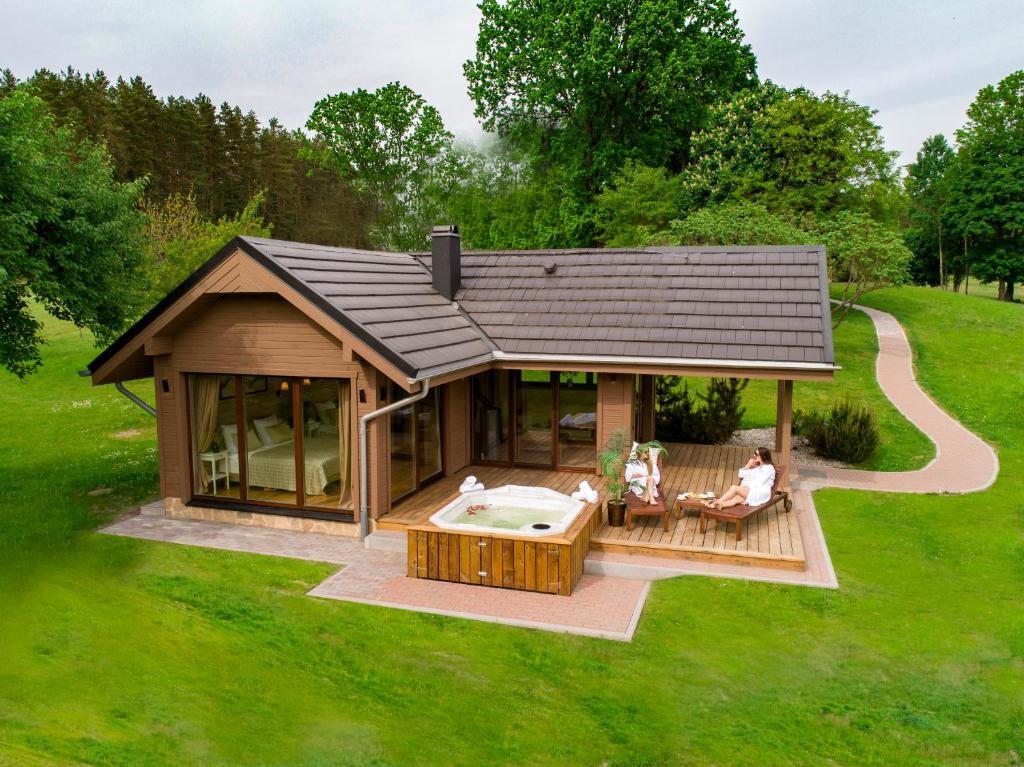 an overhead view of a tiny house with a hot tub at Harmony Park Countryside Villas & SPA in Prienai
