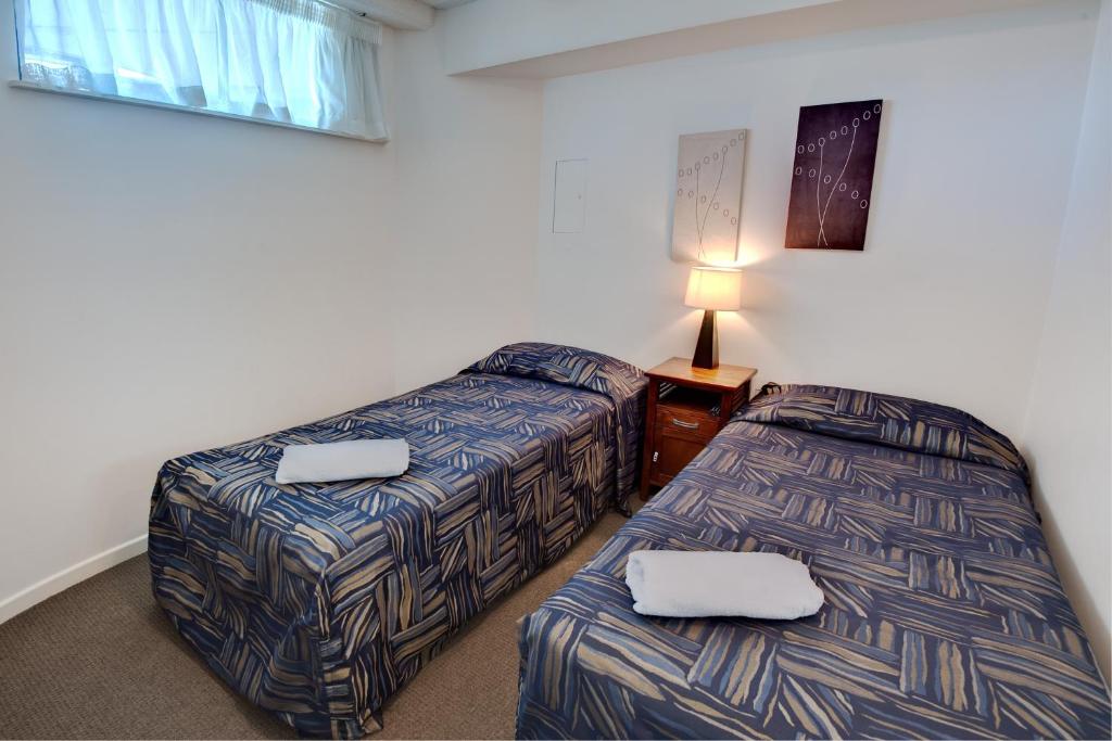 Ένα ή περισσότερα κρεβάτια σε δωμάτιο στο Nautilus Resort Mooloolaba