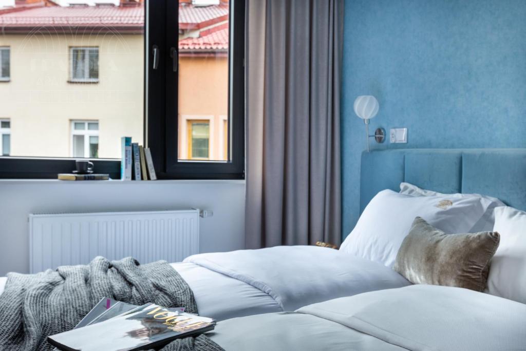 Posteľ alebo postele v izbe v ubytovaní Fragola Apartments Vistula View