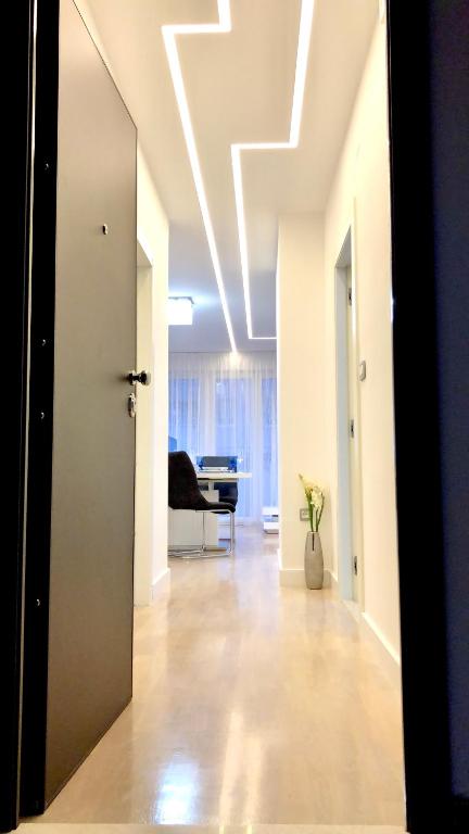 a hallway with a room with a ceiling with lights at Condo Spalato in Split