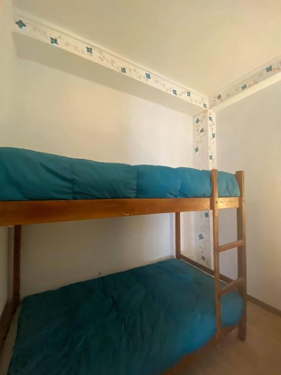 Postel nebo postele na pokoji v ubytování Hostal Chaska Wasi