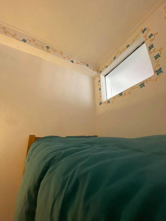 Postel nebo postele na pokoji v ubytování Hostal Chaska Wasi