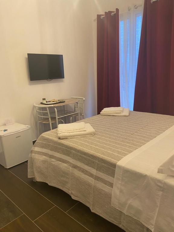 Postel nebo postele na pokoji v ubytování B&B Libertà