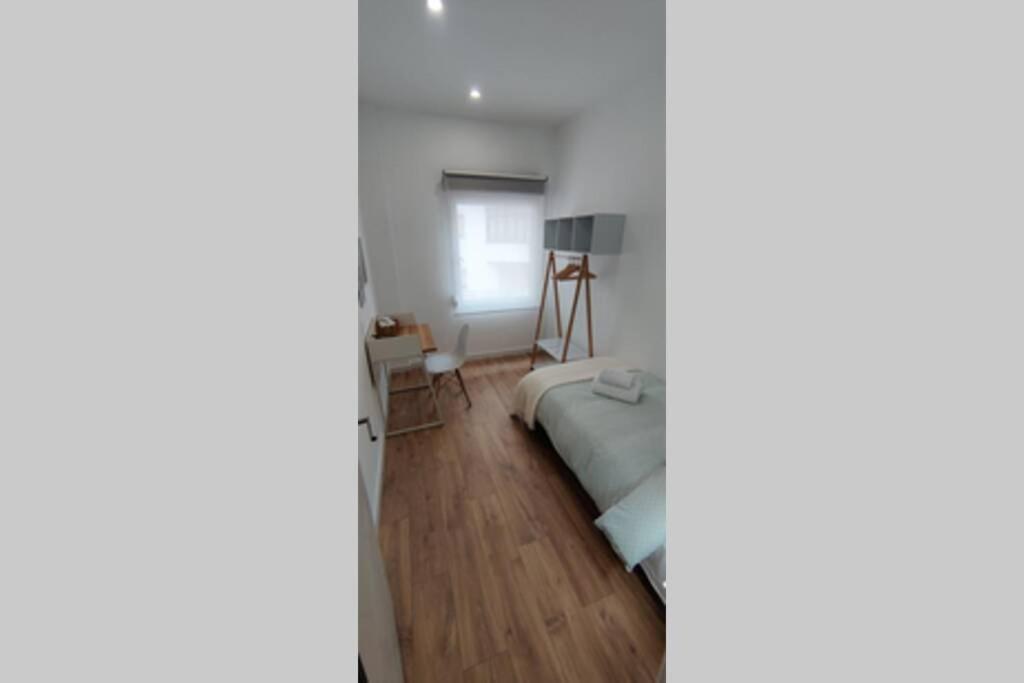 Postel nebo postele na pokoji v ubytování Xátiva Home, Loft Center