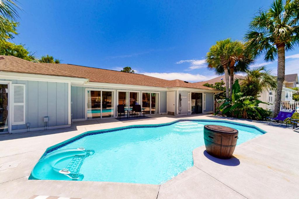a swimming pool in the backyard of a house at Wahoo 535 at Bay Point in Panama City Beach