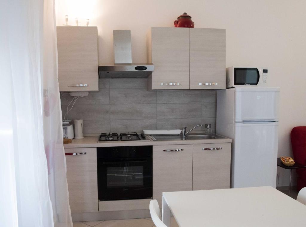 Kuchyňa alebo kuchynka v ubytovaní Principe Apartment
