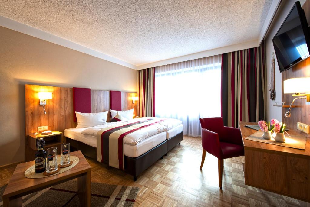 Postel nebo postele na pokoji v ubytování Genusshotel "Zum Wendl"