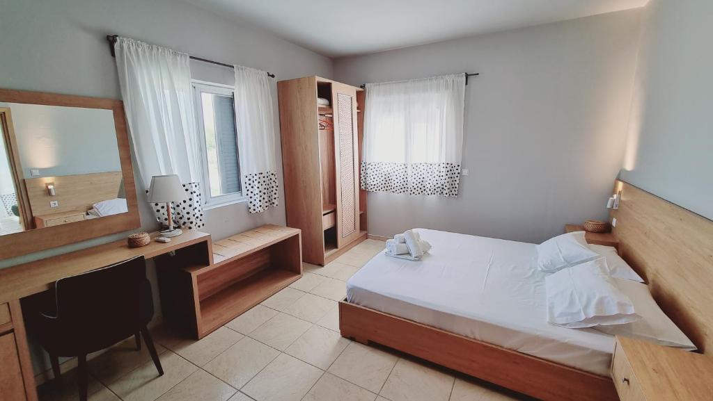 Postel nebo postele na pokoji v ubytování Chloe Apartments