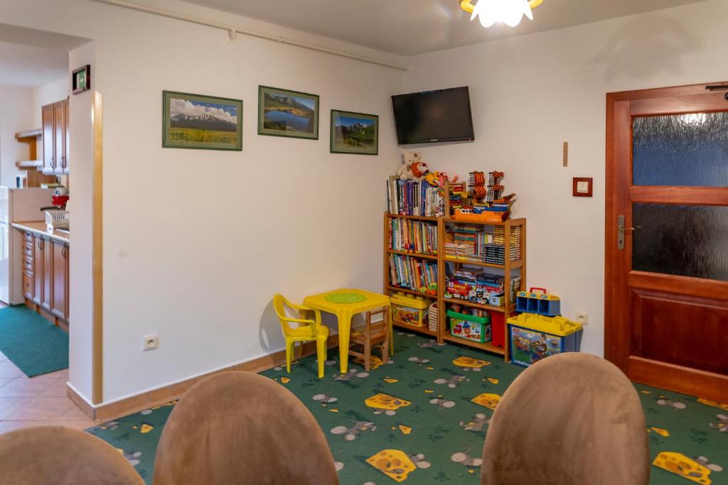 TV a/nebo společenská místnost v ubytování ASPEN