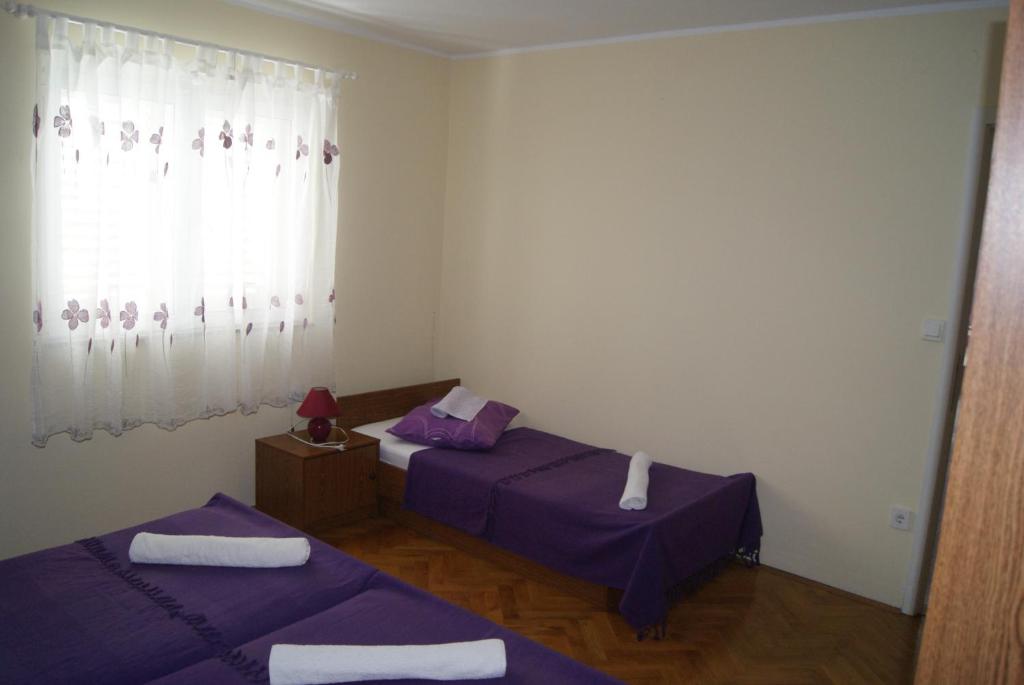 Posteľ alebo postele v izbe v ubytovaní Apartments Marta - Zadar - near the sea