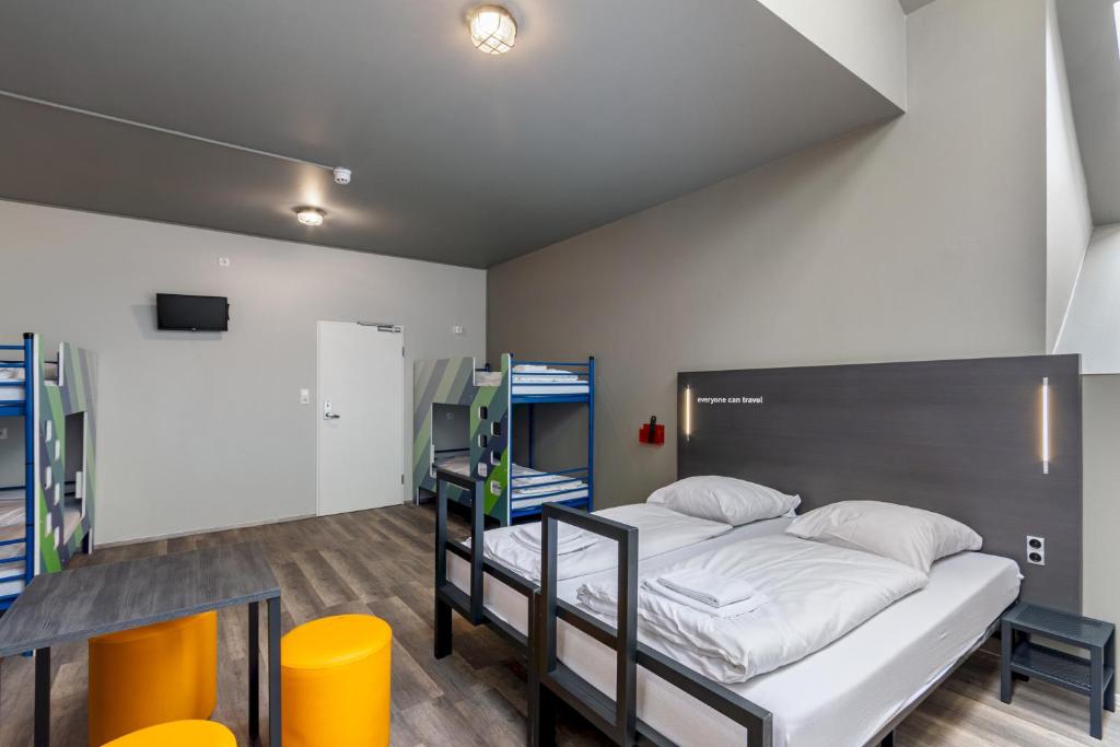 Postel nebo postele na pokoji v ubytování a&o Leipzig Hauptbahnhof