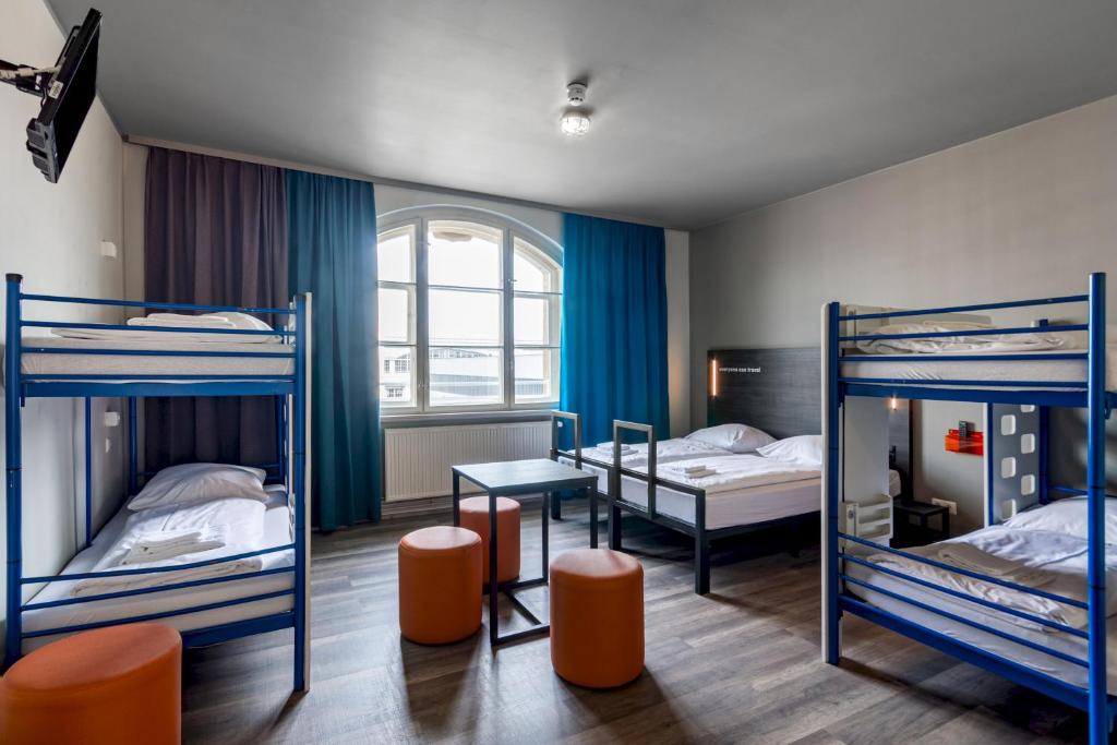 Postel nebo postele na pokoji v ubytování a&o Leipzig Hauptbahnhof