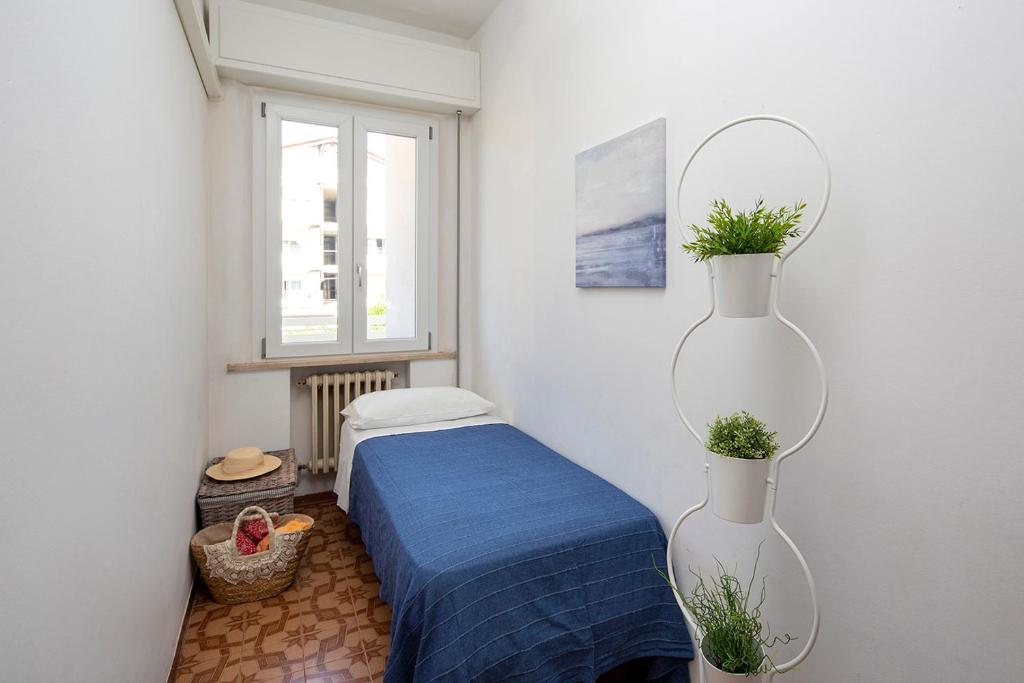 Posteľ alebo postele v izbe v ubytovaní Appartamenti Villa Miramare