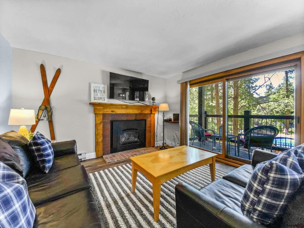 a living room with a couch and a table at Inner Circle 3 Condo in Breckenridge
