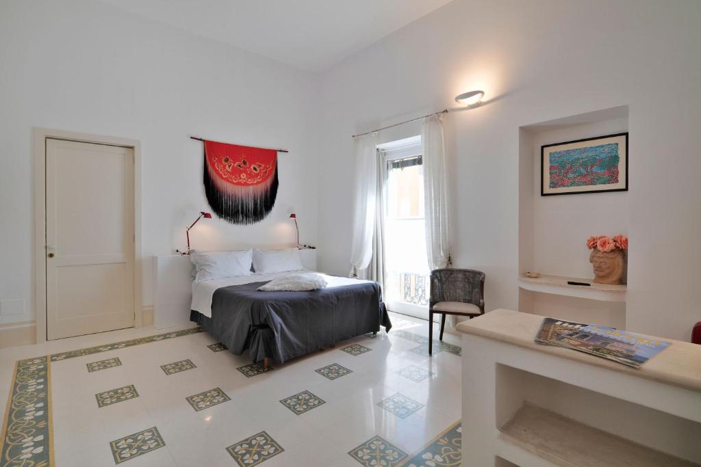 Postel nebo postele na pokoji v ubytování Palazzo Rollo