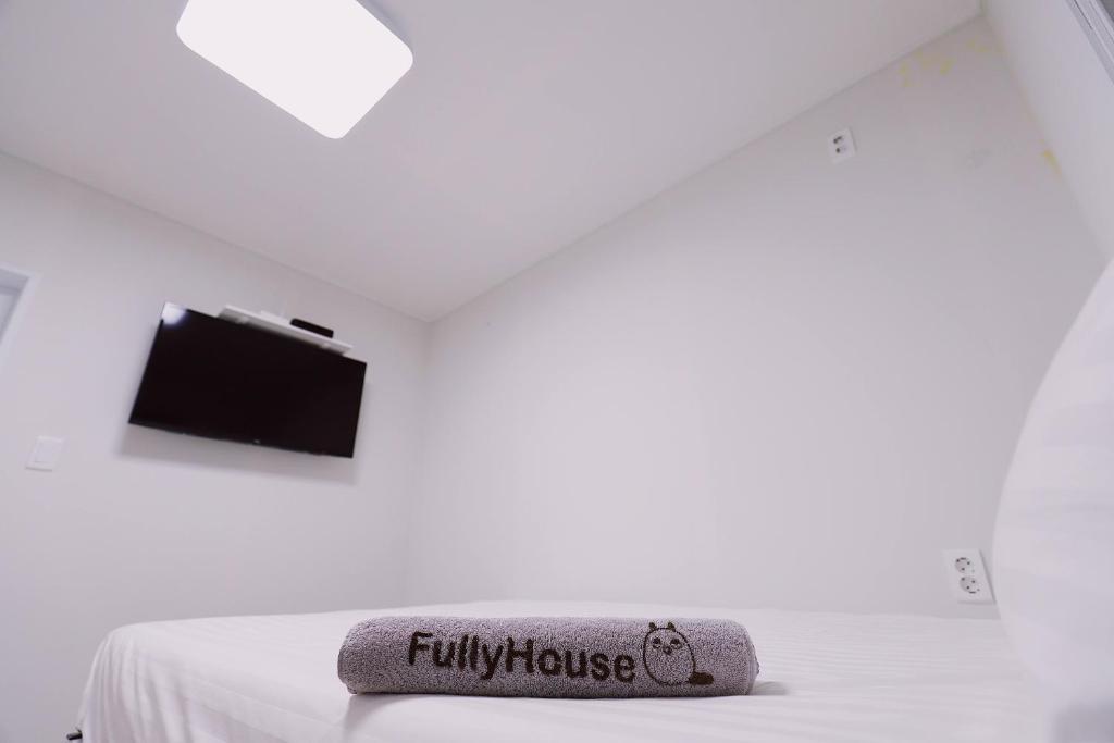 Postel nebo postele na pokoji v ubytování Fully Mini Hotel