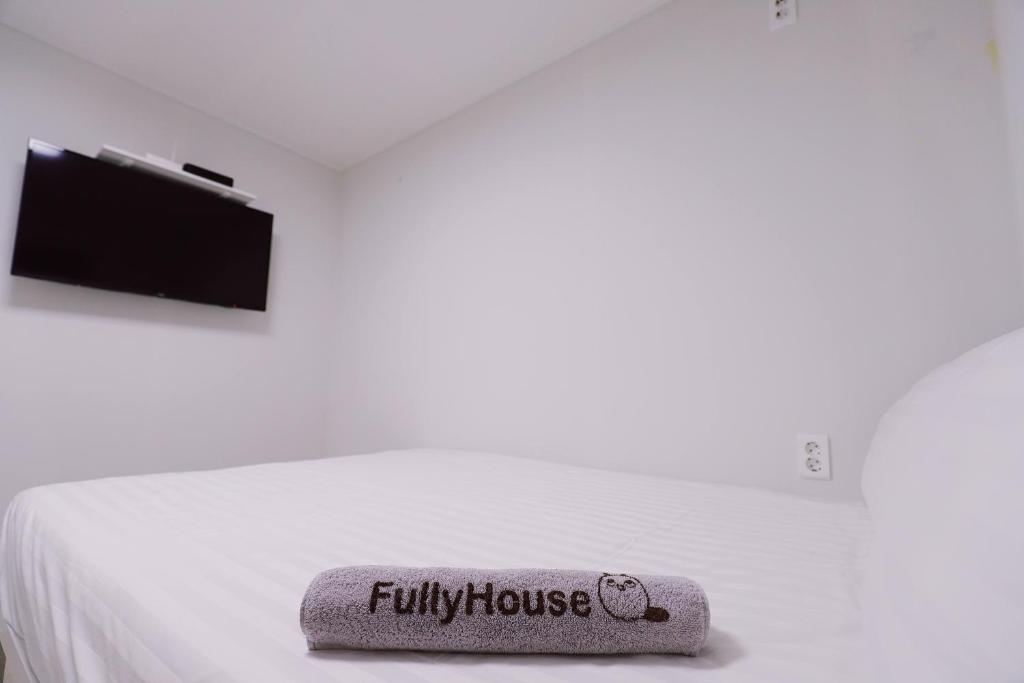 Postel nebo postele na pokoji v ubytování Fully Mini Hotel