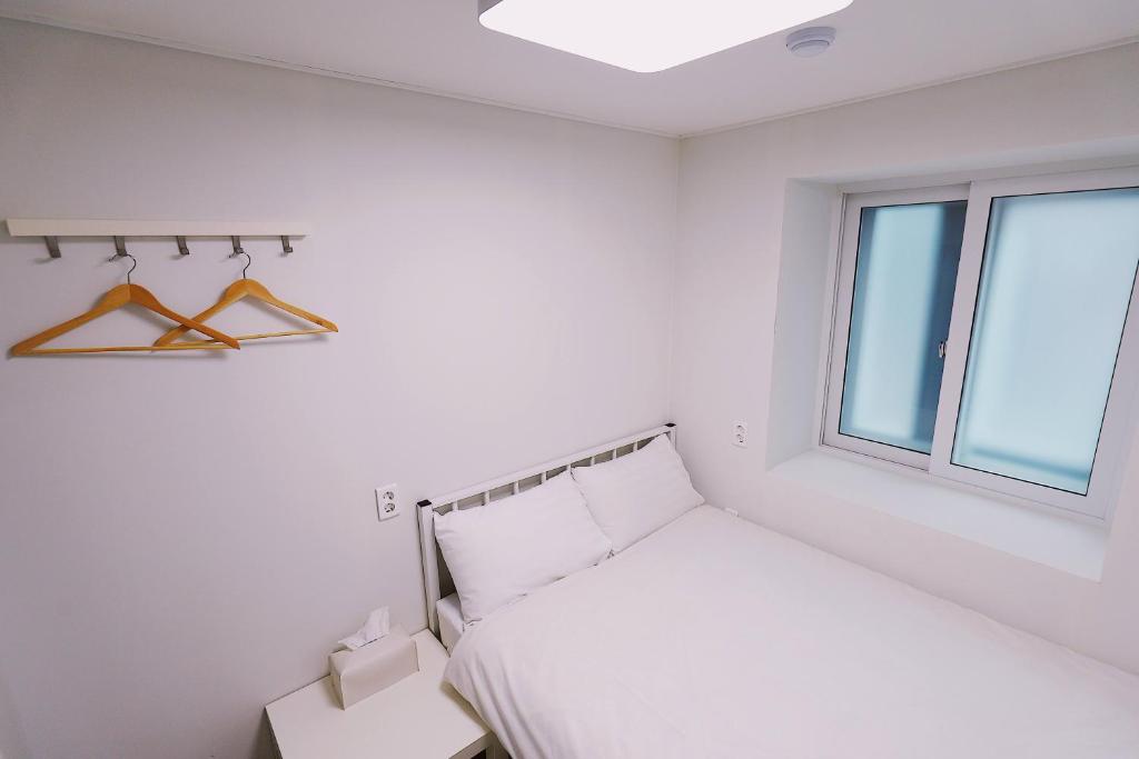 Postel nebo postele na pokoji v ubytování Fully Mini Hotel