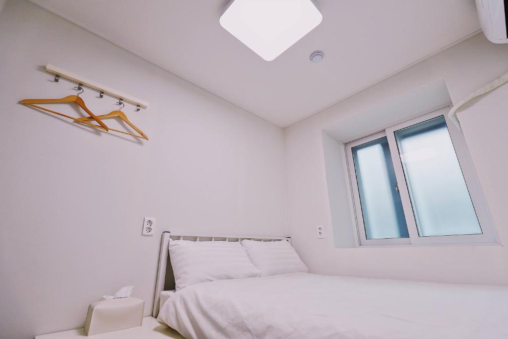 Postel nebo postele na pokoji v ubytování Fully Mini Hotel