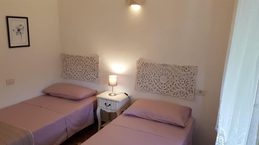 A bed or beds in a room at Casa Michelle "Natura e Relax"