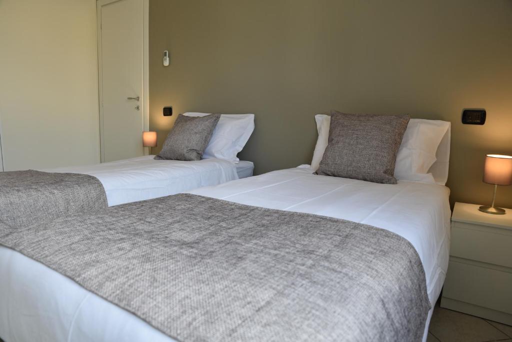 Postel nebo postele na pokoji v ubytování Rho Fiera Flat