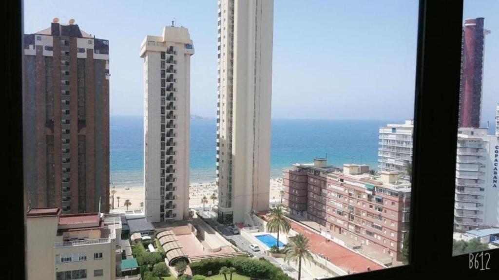 a view of a city with the ocean and buildings at Paraiso XI 1 Alquilevante in Benidorm