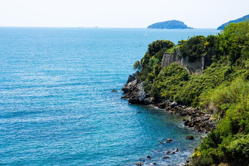 a view of the ocean from a cliff at Baia Blu RTA Residence in Lerici