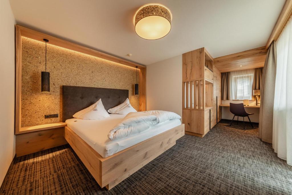 Posteľ alebo postele v izbe v ubytovaní Kräuterhotel Hochzillertal