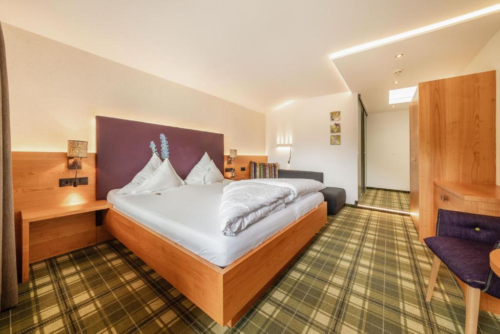 Posteľ alebo postele v izbe v ubytovaní Kräuterhotel Hochzillertal